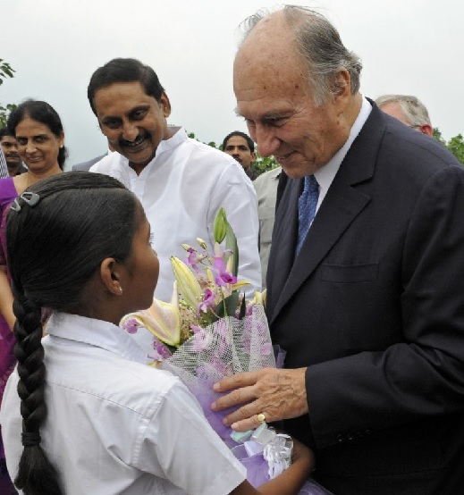 A young girl presents Mawlana Hazar Imam with flowers on the occasion of the inauguration of the Aga Khan Academy,  Hyderabad. Photo: The Ismaili/Gary Otte.