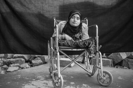 Alia sits in her wheelchair in Domiz refugee camp in the Kurdistan Region of Iraq. The 24-year-old was living with her family in Daraa, Syria, when fighting forced them to flee their home. Confined to the wheelchair and blind in both eyes, Alia says she was terrified by what was happening around her. 'Men in uniforms came and killed our cow. They fought outside our house and there were many dead soldiers. I cried and cried,' she says. Alia says the only important thing that she brought with her 'is my soul, nothing more – nothing material.' When asked about her wheelchair, she seems surprised, saying she considers it an extension of her body, not an object. Photo UNHCR/B.Sokol. Copyright.